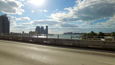 Point Of View Modern Buildings Under Cloudy Sky On Sunny Day In City - Stock Footage 219381585
