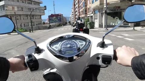 Point of view of a motorcycle driving around the city Stock Footage 131257371