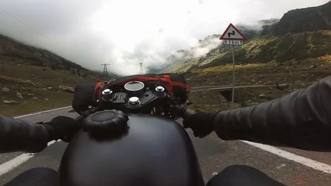 The point of view of a motorcycle rider on a mountain road Stock Footage 78225535