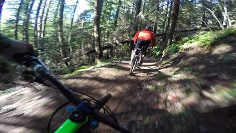 Point Of View Of A Mountain Biker Following Another Biker On A Trail  Vidéo 87054469