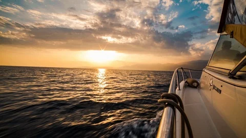 Point of view moving boat sailing near French Riviera at sunset yacht luxury Stock Footage 94453208