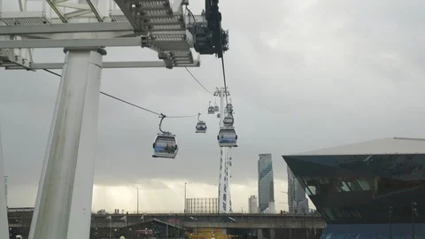 Point of view from moving cable car chairlift pulling up to station Stock Footage 123234332