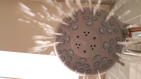A point of view of a open shower head with gushing water Video stock 122134658