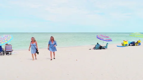 Point of view panning at Gulf of Mexico Naples Florida beach with people Stock Footage 218311714