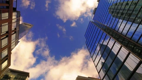 Point Of View Panning Reflection Of Buildings On Skyscrapers Under Cloudy Sky - Stock Footage 219389218