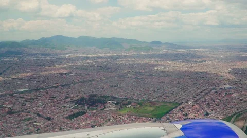 Point of view passenger looks through the window of an airplane as it flies off  Stock Footage 109505827