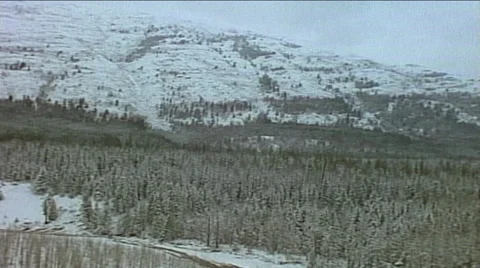 Point of view passenger train window through tunnel on snowy mountain ridge Stock Footage 29806528