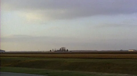 Point of view from  passenger train window tracking shot of farm house and Stock Footage 29807093