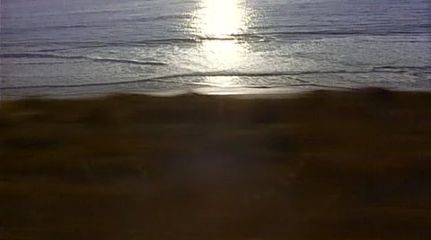 Point of view of passenger train windows traching shot right to left ocean scene Stock Footage 29806820