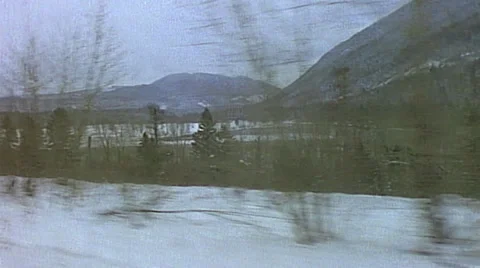 Point of view from passenger window of winter snowy scene mountain range with Stock-Footage 29807616