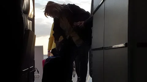 Point of view of people embarking on airplane from stairs Stock Footage 280794422