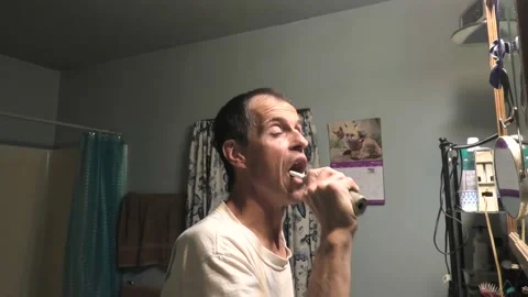 Point of View of a Person Brushing Their Teeth 스톡 동영상 154860623