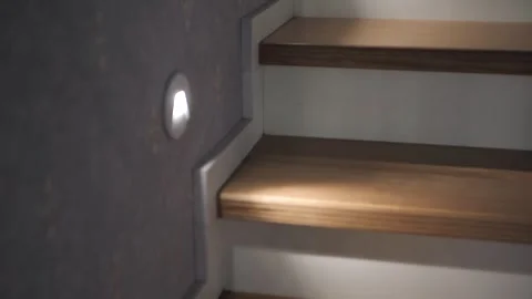 Point of view of person looking up while walking up wood stairs in house Stock Footage 293199049