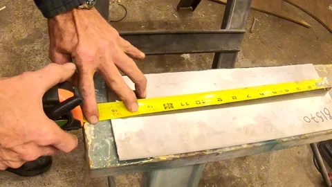 Point of View of a Person Measuring Sheet Metal Stock-Footage 156123318