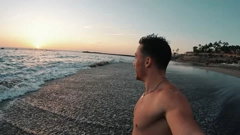 Point of view of person running and jumping to the water of an amazing beach. 動画素材 221877449