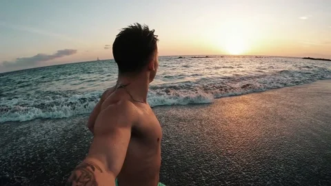 Point of view of person running and jumping to the water of an amazing beach. 動画素材 221877463