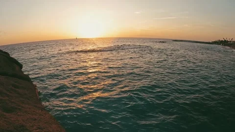 Point of view of person walking and jumping off from the cliff to the water o Stock Footage 221877328