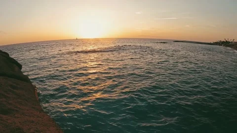 Point of view of person walking and jumping off from the cliff to the water o 動画素材 221877385