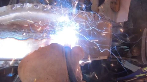 A Point of View of a Person Welding and Shaping Sheetmetal Stock-Footage 156512103
