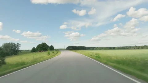 Point of View POV of car driving on scenic rural road in summer Stock Footage 200930501