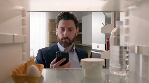 Point of view POV inside refrigerator Caucasian businessman employer man open Stock Footage 234887266