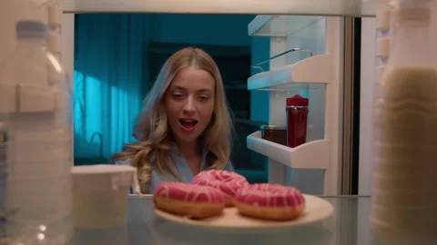 Point of view POV from inside refrigerator hungry Caucasian woman girl at night Stock-Footage 240991497