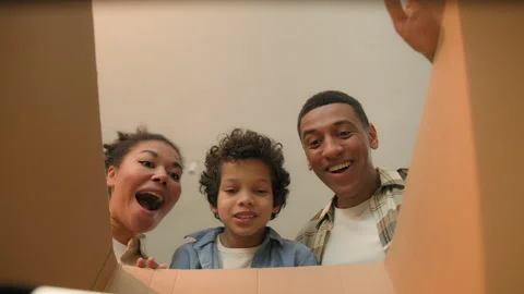 Point of view POV opening inside cardboard box happy surprised joyful African Stock Footage 271601796