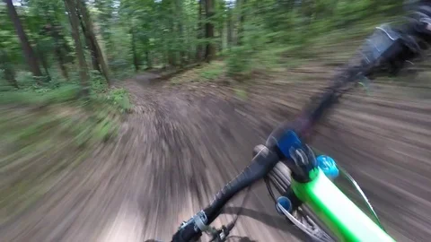 Point Of View Of Professional Mountain Biker Riding Downhill At High Speed Stock Footage 78076847