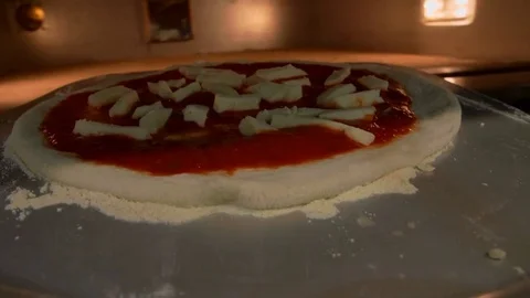Point of view of putting a pizza into the oven. POV Stock Footage 82600719