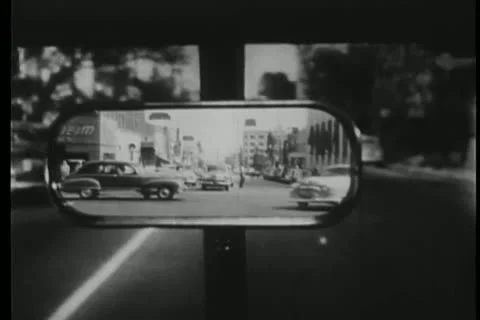 Point of view from rear view mirror of car tailing car Stock Footage 25195582
