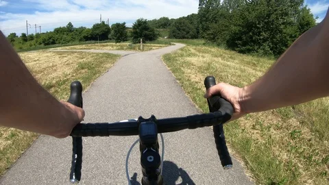 Point of view of riding a bicycle and reaching forked road Stock Footage 98228040