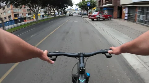Point of view riding a bicycle in fast motion through alfredo benavides avenue Stock Footage 141681019