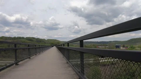 A Point of View of Riding a Bicycle Over a High Bridge Stock-Footage 158851240