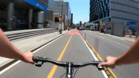 Point of view riding a bike through the new bike path of juan de arona avenue Stock Footage 141697877