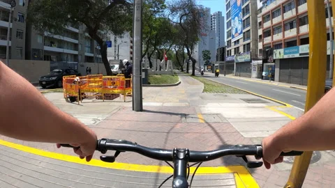 Point of view riding a bike through the cycle path of the Cercado de Lima Stock Footage 141699854