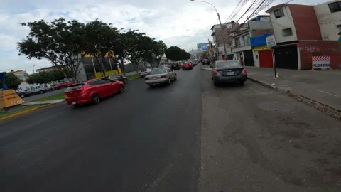 Point of view running down the avenue between cars on the road in the morning Stock Footage 149921597