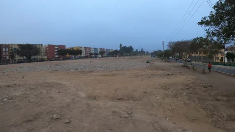 Point of view running at sunrise over dirt and stones in a wasteland Video stock 140574427