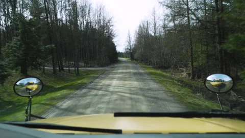Point of view of a school bus driver driving down a rural road Stock Footage 130734086