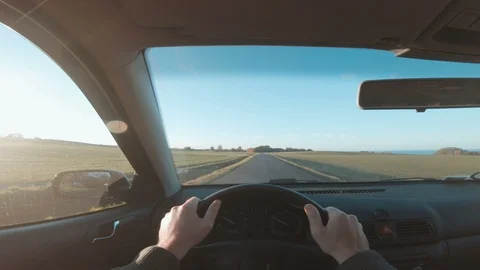 Point of view seen from driver holding on to steering wheel of a car Stock Footage 97986029