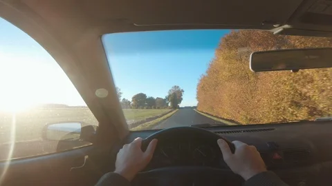 Point of view seen from driver holding on to steering wheel of a car Stock Footage 97987086