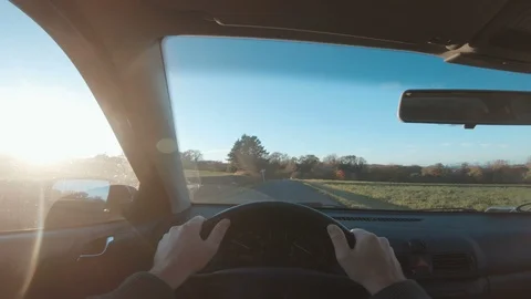 Point of view seen from driver holding on to steering wheel of a car Stock Footage 98056138