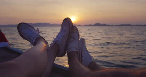 Point Of View of shoes: Adventurous couple on journey traveling on long tail boa Stock Footage 201095829