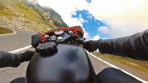 Point of view shooting of a motorcycle riding mountain road on a cloudy day Stock Footage 78225838