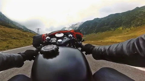 Point of view shooting of a old school motorcycle riding mountain road Stock Footage 78225564
