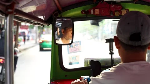 Point of View Shot Behind a Tuk Tuk Driver in Bangkok Traffic Stock Footage 325156204