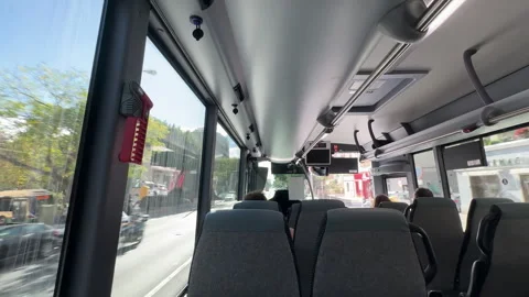 Point of view shot from a bus window showing empty seats and city streets Stock Footage 337069365
