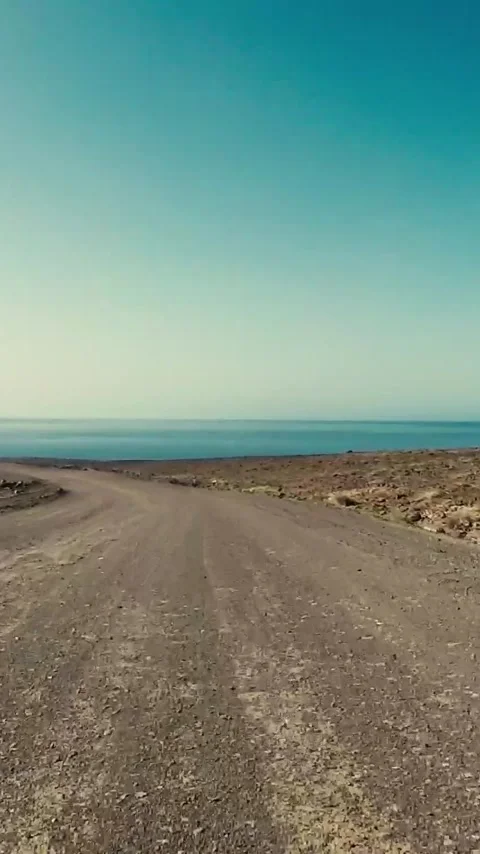 Point of view shot driving on a desolate dirt road through an arid, rocky Video stock 344820190