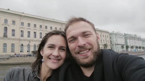 Point-of-view shot of a happy smiling couple taking a selfie. Happy lovers in Video stock 67980798