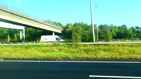 Point of view shot looking out of the side window driving along the motorway Stock Footage 244741421