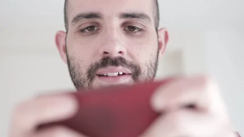 Point of View Shot Man Playing Game on his Smartphone. Closeup portrait Stock Footage 168433006